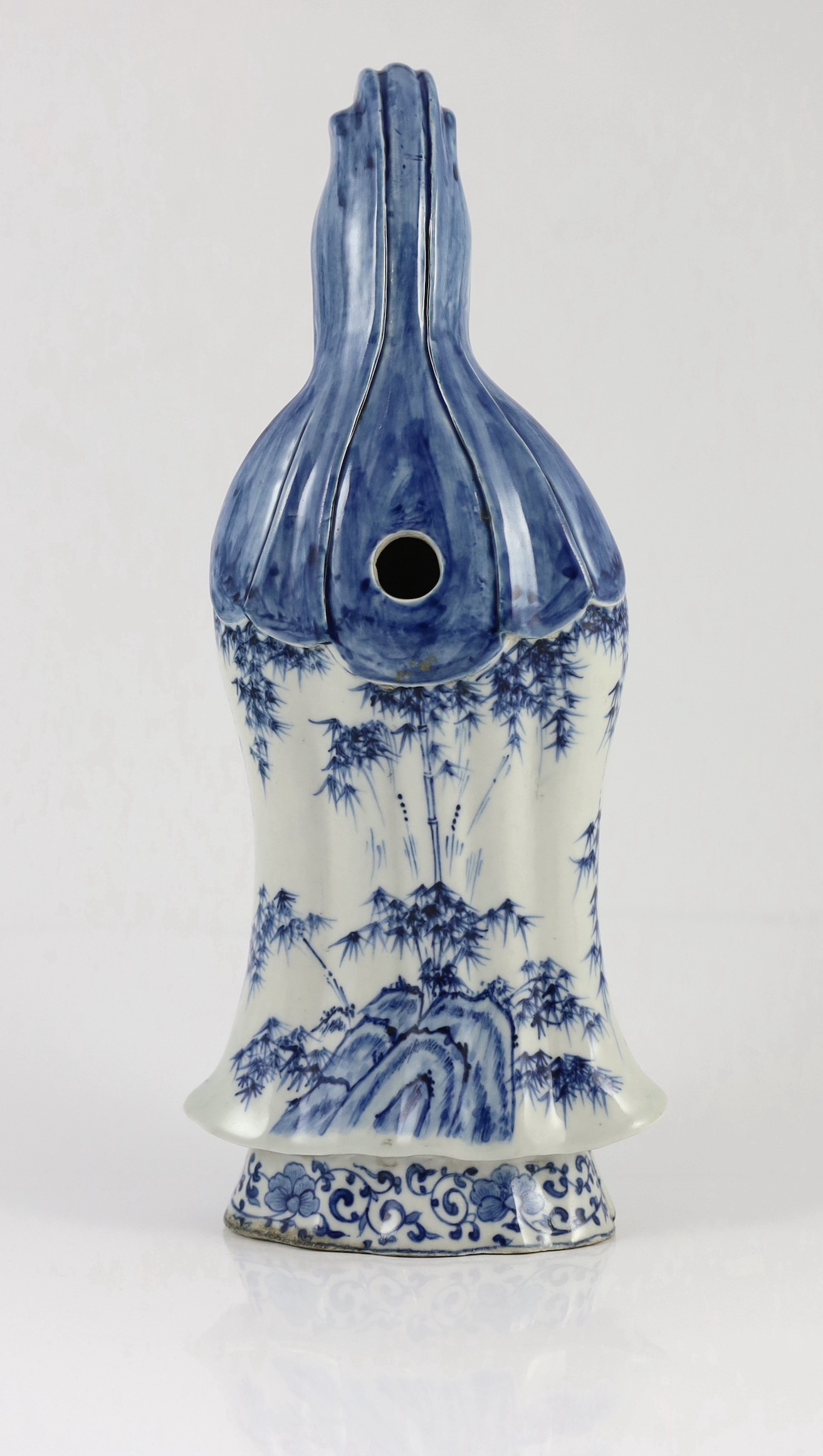 A Chinese blue and white standing figure of Guanyin, late 19th century, 34.5cm high, restoration to left foot